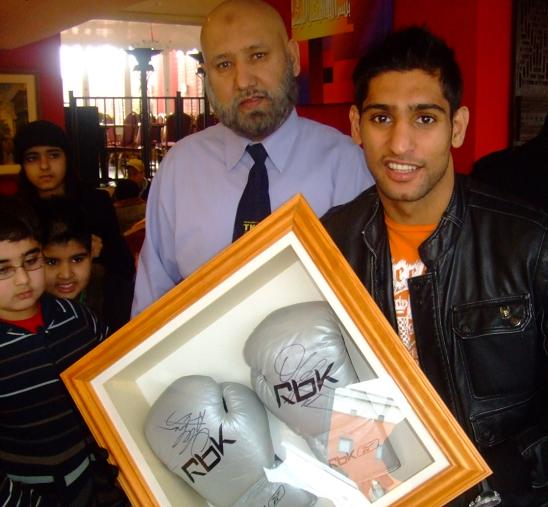 Amir Khan donates gloves in Southall